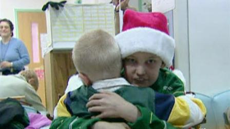 Mark Staehely hugs another young cancer patient