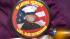 Gretchen Catherwood wears a pin honoring  her...