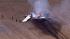 A WWII bomber plane crashed and caught fire in...