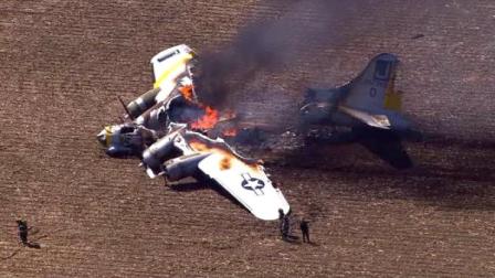 A WWII bomber plane crashed and caught fire in far west suburban Oswego Monday morning, June 13, 2011. (Chopper 7 HD image)