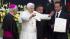 Pope Benedict XVI waves during the symbolic key...