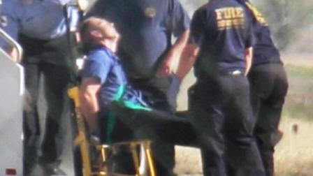 Emergency workers tend to a JetBlue captain that had a medical situation during a Las Vegas-bound flight from JFK International airport, Tuesday, March 27, 2012, in Amarillo, Texas.
