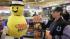 A customer smiles after receiving a free Mega...