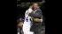 Kansas head coach Bill Self hugs guard Travis...