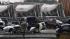 Destroyed vehicles sit in a Kenworth trailer lot...