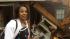 Jerica Jenkins surveys damage to her home after...