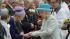 Britains Queen Elizabeth II hands out the...