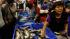 A woman buys fish at the Villa Maria del Triunfo...