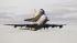 Space shuttle Discovery atop a 747 carrier jet departs the Kennedy Space Center, Tuesday, April 17, 2012, in Cape Canaveral, Fla. Discovery is being transported to the Smithsonian National Air and Space Museum in Washington.