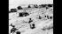 Sitting in the cover of their foxholes, American...