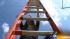 Judy climbs the ladder for her trapeze lesson....
