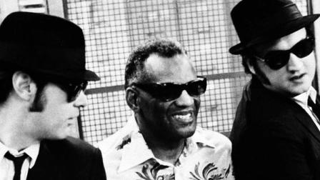 Jake and Elwood Blues (Dan Aykroyd and John Belushi) bargain with music store owner Ray Charles over instruments on Chicagos colorful Maxwell Street in September 1982. (AP Photo)