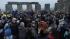 People gather at the Stonehenge monument in...