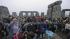 People gather at the Stonehenge monument in...