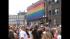 People line the Pride Parade route on North...