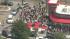 Throngs of people lined up outside the...