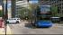 A Megabus.com bus making a left turn onto Adams...