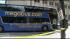 A Megabus.com bus making a left turn onto Adams...
