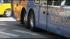 A Megabus.com bus making a left turn onto Adams...