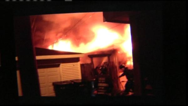 Smartphone video captured flames lighting up the alleyway between Berwyn and Farragut in Chicago's Andersonville neighborhood, Wednesday, August 8, 2012.