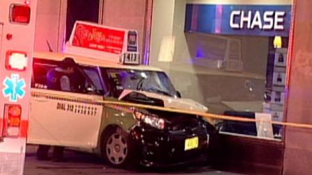 Three people were hurt when a taxi crashed into a bank in downtown Chicago Wednesday night, August 8, 2012.