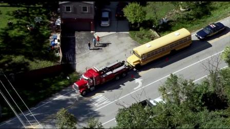 Chopper 7 HD image shows a tow truck pulling a school bus after a crash in northwest suburban Bensenville, Tuesday, September 11, 2012.