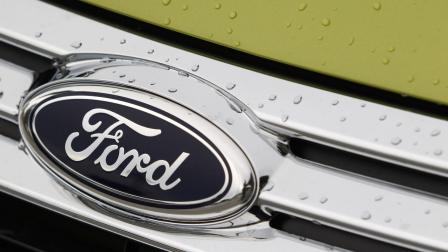 In this file photo raindrops are on the grill of a 2012 Ford Fiesta SE at the Maroone Ford of Miami dealership. (AP Photo/Wilfredo Lee/file)