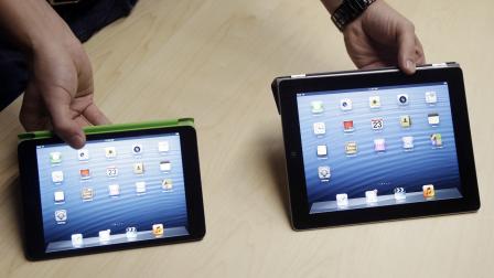 The iPad Mini, at left, is shown next to the 4th Generation iPad in San Jose, Calif.