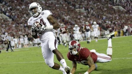 Texas A&M wide receiver Malcome Kennedy (84) catches the game winning touchdown as Alabama defensive back Dee Milliner (28) defends during the second half of an NCAA college football game at Bryant-Denny Stadium in Tuscaloosa, Ala., Saturday, Nov. 10, 2012. (AP Photo/Dave Martin)