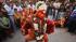 An Indian man dressed as a monkey god Hanuman...