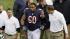 Chicago Bears guard Lance Louis (60) is helped...