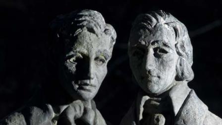 The bronze figures of Wilhelm (left) and Jacob Grimm are seen on the Brueder-Grimm Platz in Kassel