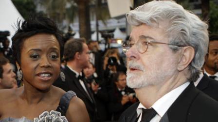Director George Lucas, right, and Mellody Hobson arrive for the screening of Cosmopolis at the 65th international film festival, in Cannes, southern France, Friday, May 25, 2012. (AP Photo/Lionel Cironneau)