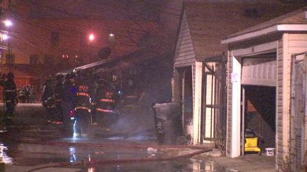 Firefighters battled two suspicious garage fires within a block of each other on the citys West Side Tuesday morning, January 15, 2013.