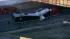 A semi truck got stuck under some railroad...