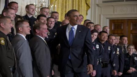 President Barack Obama stands for a photo with 2013 National Association of Police Organizations (NAPO) TOP COPS award winners during a ceremony in East Room of the White House, Saturday, May 11, 2013, in Washington. To Obamas left is NAPO President Tom Nee. (AP Photo/Carolyn Kaster)
