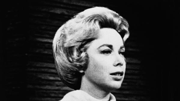 Psychologist Dr.Joyce Brothers shown in the studio of her direct line radio show, saved a would-be suicide.