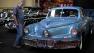 In this file photo, a car enthusiast looks at a 1948 Tucker Torpedo on display at the Barrett-Jackson Collector Car Auction in Las Vegas.   (AP Photo/Julie Jacobson)