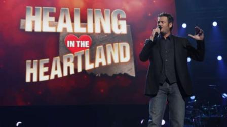 This image released by NBC Universal shows country singer Blake Shelton during the Healing in the Heartland: Relief Benefit Concert at the Chesapeake Energy Arena in Oklahoma City, Okla.