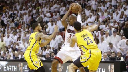 Miami Heat guard Ray Allen (34) looks to pass as Indiana Pacers forward Gerald Green (25) and guard D.J. Augustin (14) defend during the second half of Game 7 in their NBA basketball Eastern Conference finals playoff series in Miami.
