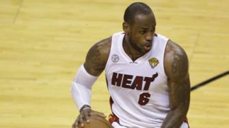 Miami Heat small forward LeBron James (6) dribbles the ball during the second half of Game 6 of the NBA Finals against the San Antonio Spurs in Miami.