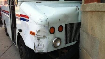 A United States postal worker was charged with misdemeanor DUI after crashing his truck on the near West Side Friday afternoon.