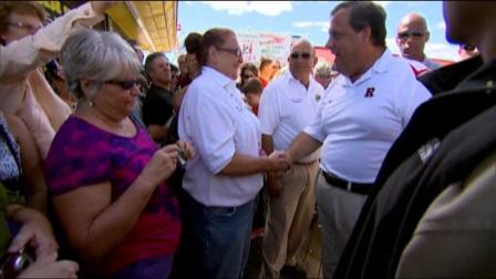 Gov. Chris Christie greets residents and store owners following a massive Jersey shore boardwalk fire this week.