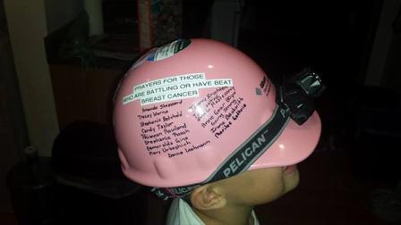 Brian Przybylski is wearing the names of women affected by breast cancer on his hard hat for October