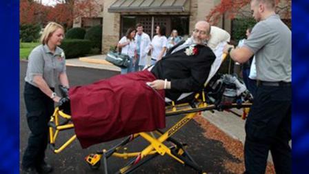 In this Oct. 12, 2013 photo, Scott Nagy is wheeled from First Lutheran Church in Strongsville by paramedics Melissa Powell, left, and Andrew Gorman, right, to a spot in the parking lot so he could see his daughter, Sarah Salvatore, and new husband, Angelo Salvatore, come out of the church doors after their wedding ceremony at First Lutheran Church in Strongsville, Ohio. University Hospital sent a medical team along with Scott who is bound to his bed. The ambulance ride to the church was donated by Physicians Medical Transport. (AP Photo/The Plain Dealer, John Kuntz)