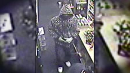 Investigators say this man walked into Buzs Liquor Store on Lincolnway Avenue, showed a gun to an employee and demanded cash from the register.