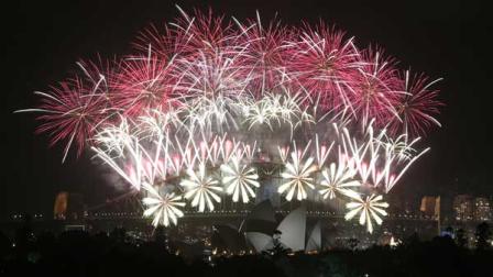 Fireworks explode over the Harbour Bridge and the Opera House during New Years Eve celebrations in Sydney, Australia, Wednesday, Jan. 1, 2014.