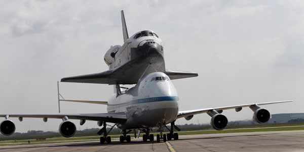 The space shuttle Endeavour is shown taxiing...