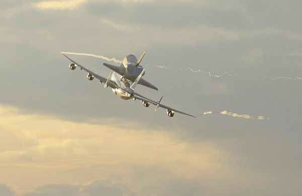 The space shuttle Endeavour is shown taxiing...
