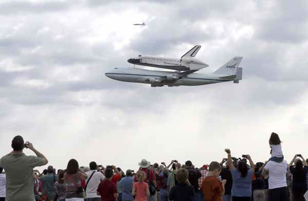 The space shuttle Endeavour is shown taxiing...